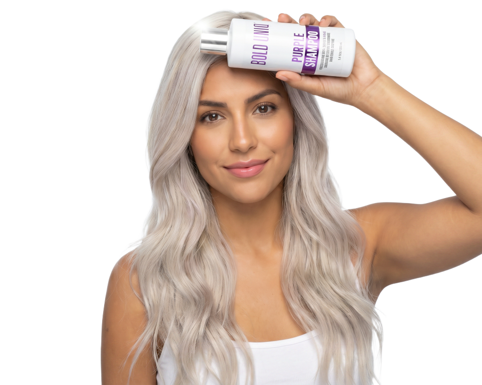 Latina woman with platinum-blonde hair holding a Bold Uniq Purple Shampoo bottle
